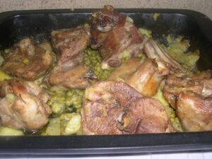 capretto al forno piselli e patate