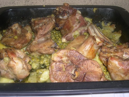 capretto al forno piselli e patate